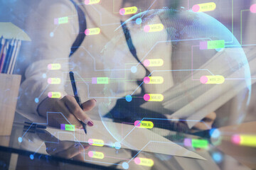 Multi exposure of woman's writing hand on background with data technology hud. Big data concept.