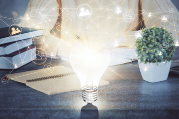 Social network theme hologram over woman's hands writing background. Concept of international people connect. Double exposure