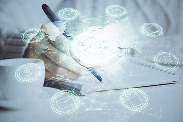 Social network theme hologram over woman's hands writing background. Concept of international people connect. Double exposure