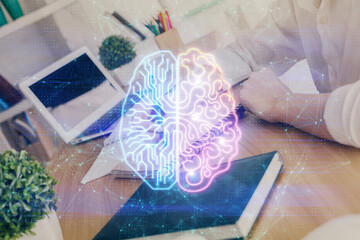 Multi exposure of writing hand on background with brain hologram. Concept of learning.