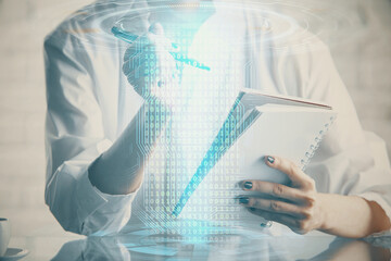 Multi exposure of hands making notes with digital coding icons. Computer learning concept.