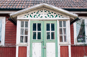Close up of a typical old and red house in the swedish countryside, woodwork exterior