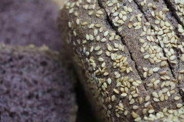healthy bread made with black rice on a wooden background