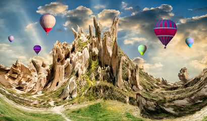 Hot Air balloons flying tour over Volcanic Mountains of Cappadocia, Turkey, Goreme national park....