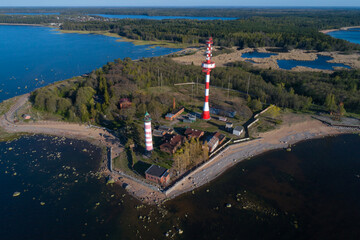 Fototapeta na wymiar View of the Shepelevsky lighthouse on a May sunny day (aerial photography). Leningrad region, Russia
