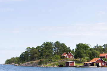 Fototapeta na wymiar Typical swedish seaside town, red houses in the Swedish archipelago, summer in Sweden