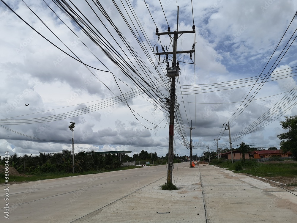 Wall mural road construction mistakes with power pole in the middle of the road.