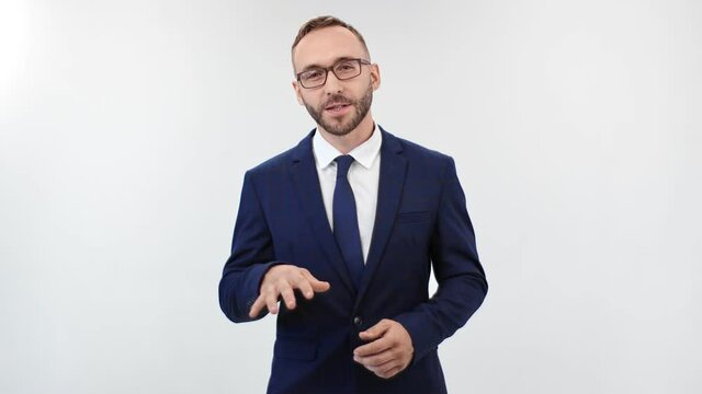 Smiling trendy man in suit talking standing isolated on white. Shot on RED Raven 4k Cinema Camera
