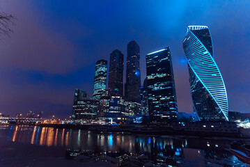 Moscow city skyscraper towers by the river in the Russian capital at night