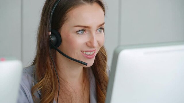 Business people wearing headset working in office to support remote customer or colleague. Call center, telemarketing, customer support agent provide service on telephone video conference call.