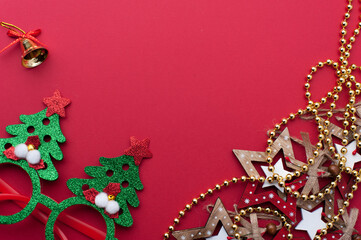 Christmas Headband, Funny Glasses With Green Trees and Wooden Toys on Red Background.