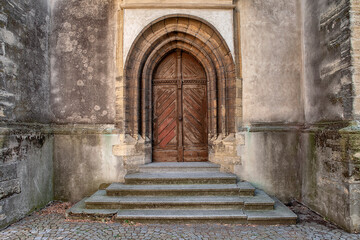 Old baroque door to church. Side door to ciric. Side minster door. Lateral barocco door to gospel mill. Side entrance to gospel-mill.
