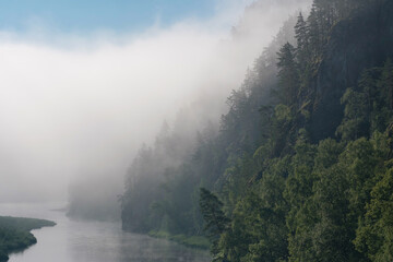 Fototapeta na wymiar Morning mist on the water of Belaya river. Bashkiria national park, Bashkortostan, Russia.