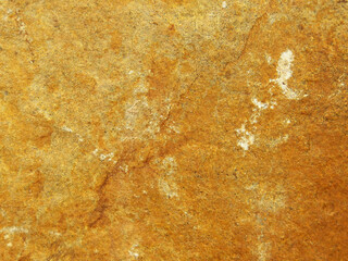 Raw rocks natural surface material with textured details. The main colors is orange but globally there is ocre light-orange strong-orange and grey copper areas. Close-up 4x3 photography