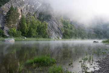 Ural landscape. Morning mist on the water of Belaya river. Bashkiria national park, Bashkortostan, Russia.