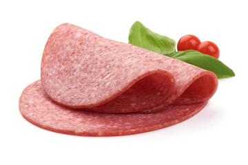 Dry salami sausage slices with basil leaves, close-up, isolated on a white background.