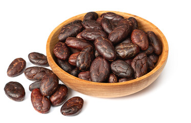 peeled cocoa beans in the wooden bowl, isolated on white background