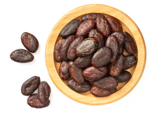 dried cocoa beans in the wooden bowl, isolated on white background, top view