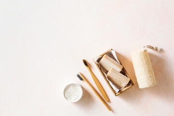 Eco-friendly bathroom accessories, reusable sponges for washing, tooth powder, toothbrushes. Flat lay. Copy space.