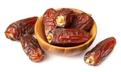 dried date palms in the wooden bowl, isolated on white background