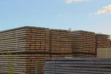 Pallet storage of wood in the company in the industrial zone of the city on a spring day