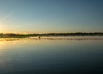 Foggy weather early in the morning on the lake. beautiful wallpapers. a mystical mist vibrates in the lake. summer sunrise