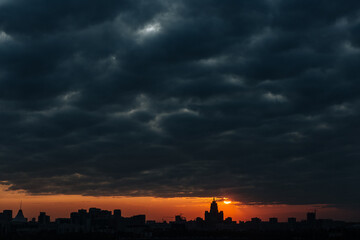 The absorption of the city in a dark sunset