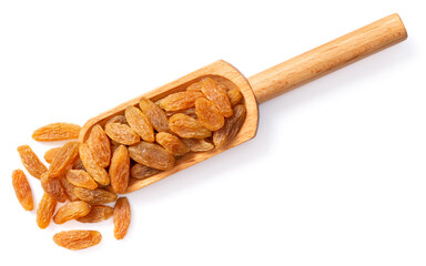 yellow raisins in the wooden scoop, isolated on white background, top view