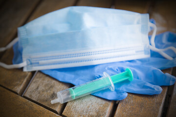 medical gloves and mask with syringe