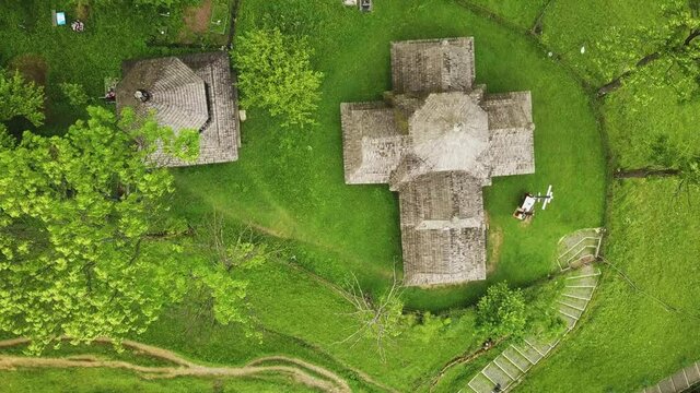 Wooden church in Carpathian, Ukraine. Aerial shot