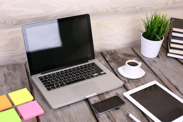 Tablet and PC on wooden table