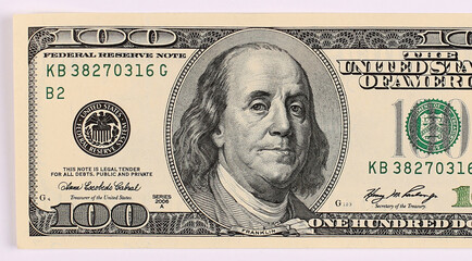 Close up of one hundred dollars isolate on white background.