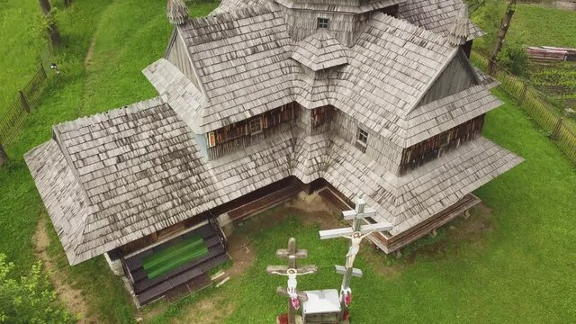 Wooden church in Carpathian, Ukraine. Aerial shot