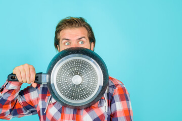 Crazy chef. Man with frypan. Happy man chef with pot. Fry-pan. Cooking. Kitchenware. Cooking...