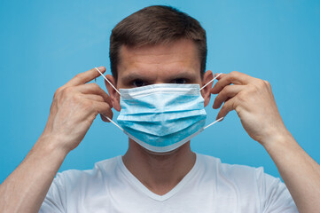 Portrait of man wearing an anti virus protection mask to prevent corona virus.