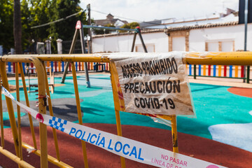 Fototapeta na wymiar Signs that prohibit the use of a playground during de-escalation due to coronavirus. Posters: 