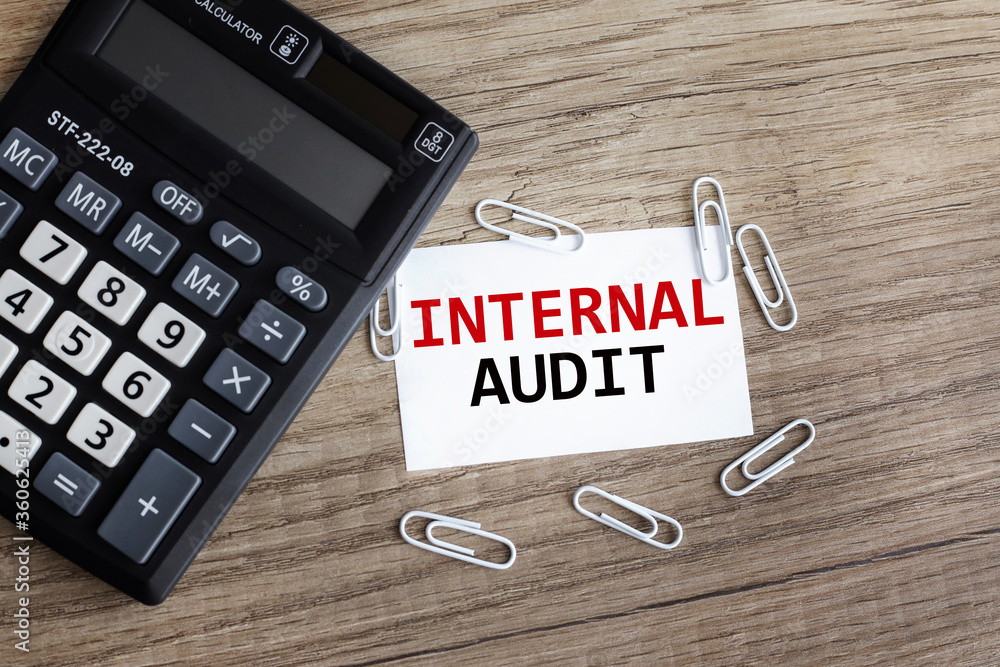 Poster internal audit.card with text. on a table on a white background