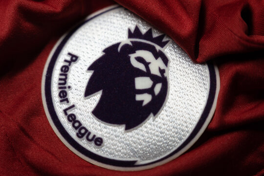 The logo of the new english premier league logo on red football jersey