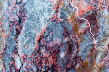 Stone background, multicolored marble slab with various lines and cracks