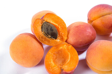 Orange apricots on a white background.