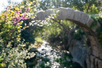 The small stone roman bridge,bokeh effect
