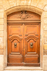 Avignon, an old wooden door, typical building in the south of France
