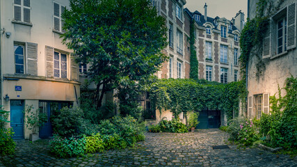Fototapeta na wymiar Paris, France - June 26, 2020: Cour de Rohan. Beautiful courtyard near Saint Germain des pres district in Paris