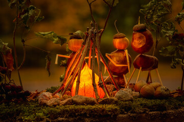 chestnut figure model of people around a fire in the woods