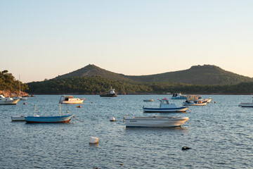 Fototapeta na wymiar Boats on the sea in hill background