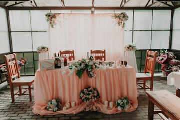 wedding decor, a table for the newlyweds decorated with flowers and purple fabric