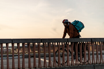 Bicycle messenger, commuter with road bicycle in the city