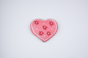 A heart-shaped pink gingerbread.