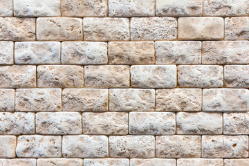 Decorative stone for decoration of the fireplace. Brick orange wall, brick background. close up. Background