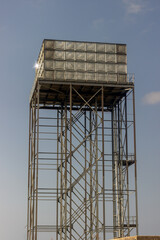 raised up steel water tower on steel frame